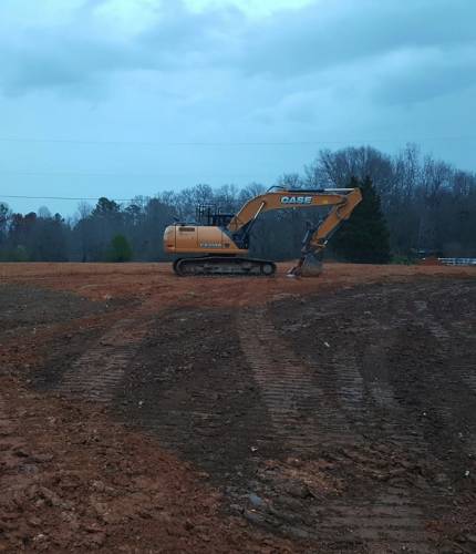 site-preparation excavator doing site prep
